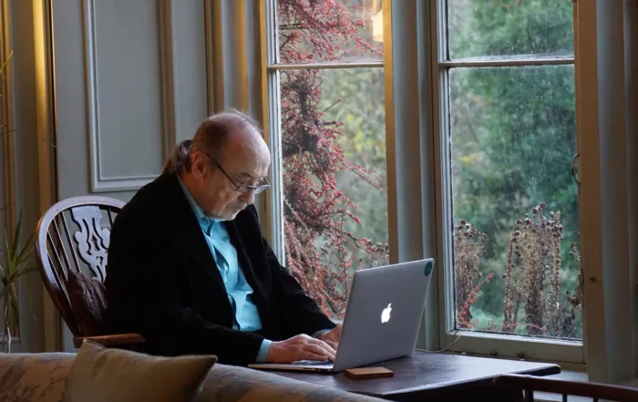 older gentleman working on laptop