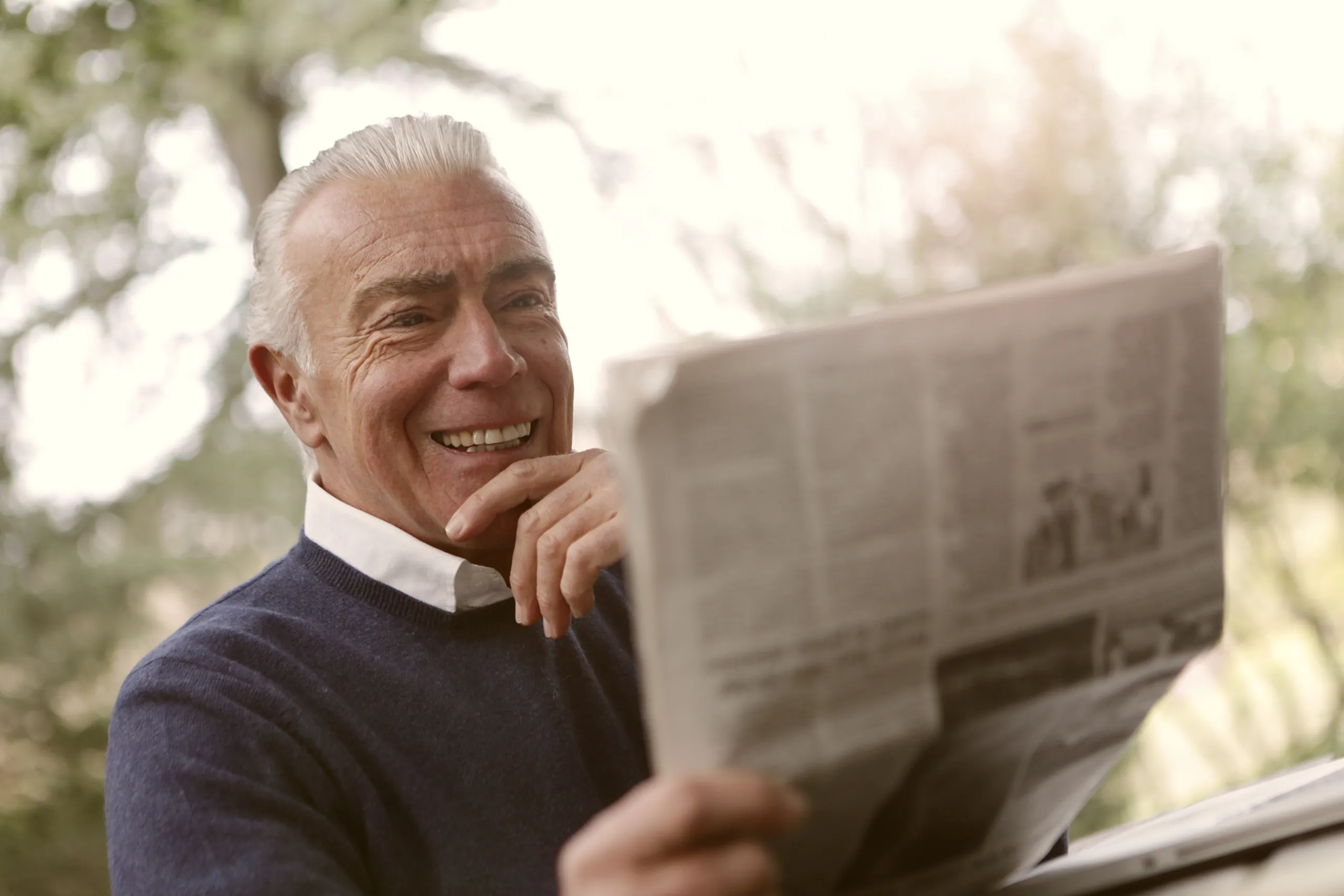 older gentleman reading newspaper