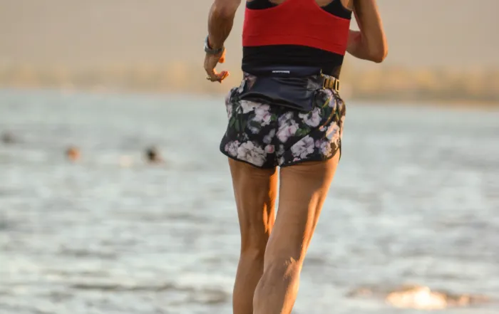 female running on beach